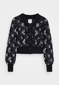 Musta napillinen neuletakki, jossa on harmaa ja valkoinen timanttikuvio sekä puffatut pitkät hihat, lyhyt malli, ribbireunat hihoissa ja helmassa.