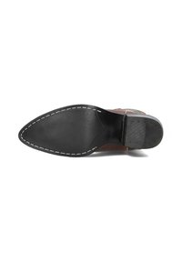 Brown leather shoe sole with a pointed toe, black rubber bottom, contrasting white stitching, and textured surface for grip.
