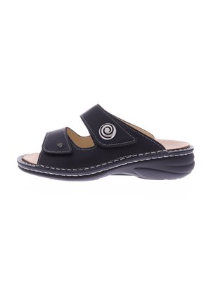 Black leather sandal with two adjustable straps, a spiral accent, and a cushioned footbed. Features a rounded, textured sole for comfort.