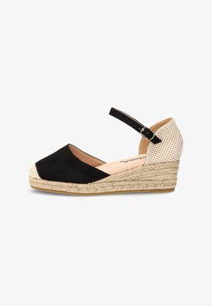 Zapato de cuña espadrille para mujer con puntera cerrada negra, tacón beige a cuadros, correa en el tobillo y suela trenzada de yute.