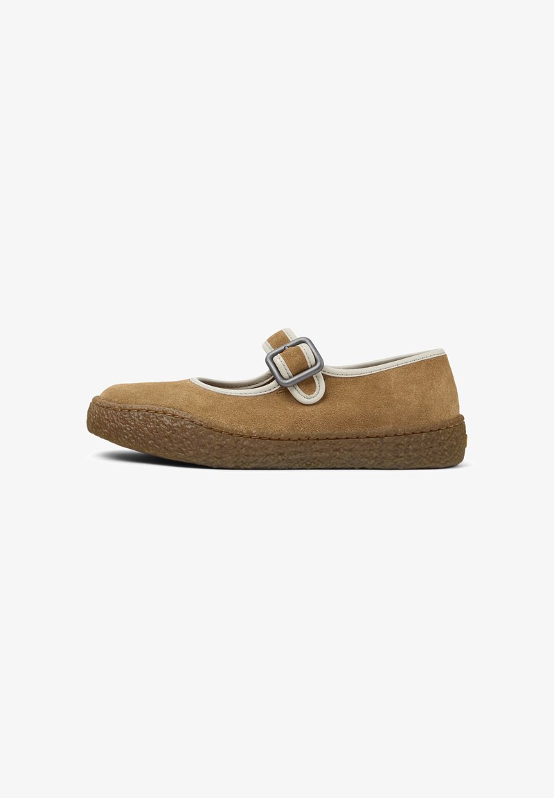 Brown suede Mary Jane shoe with a rounded toe, white trim, and a decorative buckle. Textured rubber sole provides grip.