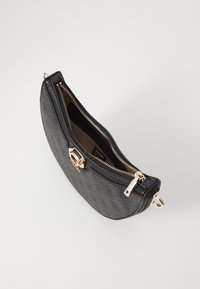 Black zippered handbag with textured surface, gold hardware accents, and a curved shape, showcasing a spacious interior.