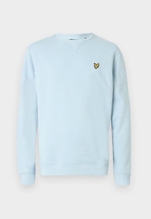 Sudadera azul claro hecha de tela suave. Presenta cuello y puños acanalados, y un pequeño logo amarillo bordado en el pecho.