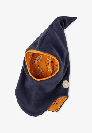 Navy fleece hood with a pointed top, orange lining featuring leaf and star patterns, and a circular logo patch on one side.