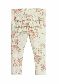 Bloemenleggings in crème met roze en groene rozenpatronen. Voorzien van gerimpelde details op de tailleband en een gegolfde zoom. Katoenen materiaal.
