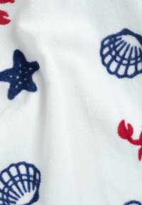 White fabric with red lobster and blue starfish and shell patterns, featuring a soft, textured surface.