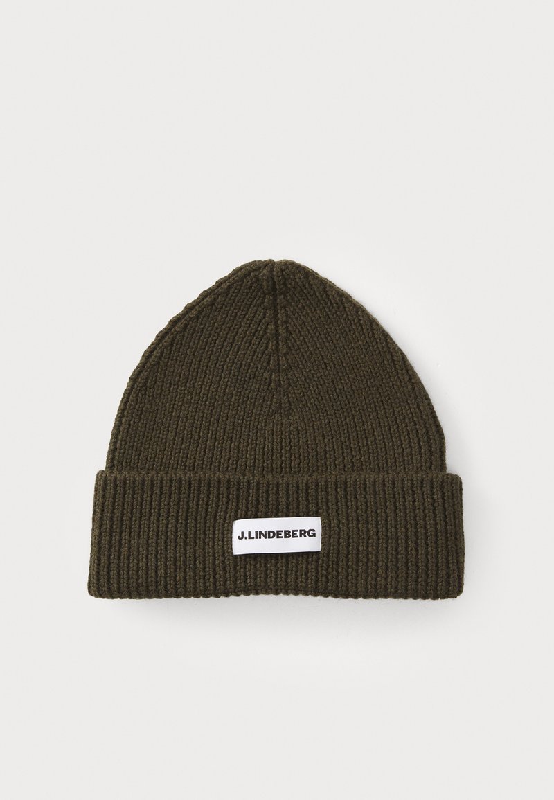 Olive green knit beanie with ribbed texture and a folded cuff. Features a white label with "J. Lindeberg" logo attached on the side.