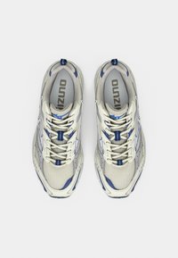 Light gray mesh athletic shoes with blue accents, round toe, and intricate lace-up design. Features a textured sole for grip.