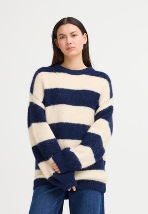 Gestreifter Pullover in Marineblau und Creme, aus weichem, flauschigem Material. Verfügt über einen runden Halsausschnitt und lockere Ärmel.