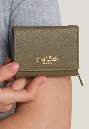 Olive green leather wallet with a textured finish, featuring gold foil branding. Compact design with a zippered closure on the side.