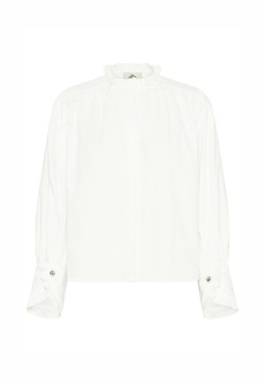 Valge pika varrukaga pluus, millel on kõrge, volangidega krae. Omab nööbitavaid varrukaotsi ja siledat puuvillast tekstuuri. Lihtne, ühevärviline disain.