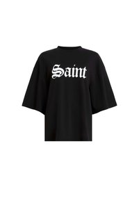 Zwarte oversized t-shirt gemaakt van katoen, met grote witte tekst "Saint" in een gestileerd lettertype over de borst. Korte, brede mouwen.