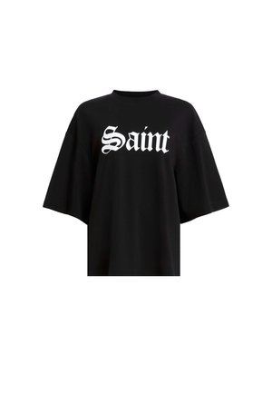 Sort oversized t-shirt lavet af bomuld, med stor hvid "Saint" tekst i en stilfuld skrifttype på tværs af brystet. Korte, brede ærmer.