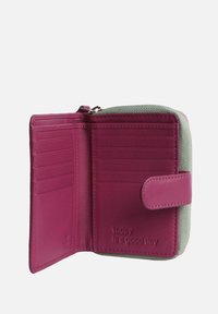 Pink leather wallet with a green fabric exterior. Features card slots and a zippered compartment. Embossed text reads "today Is a good day."