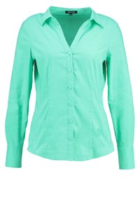 Camicia a maniche lunghe verde menta con colletto, chiusura frontale a bottoni e una texture liscia. Presenta un design aderente e un orlo curvo.