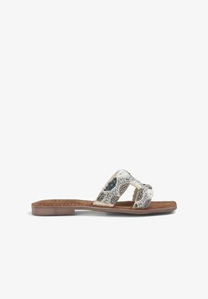 Beaded flat sandals featuring a beige leather base and a braided design with silver and blue accents, open-toe style, with a flexible sole.