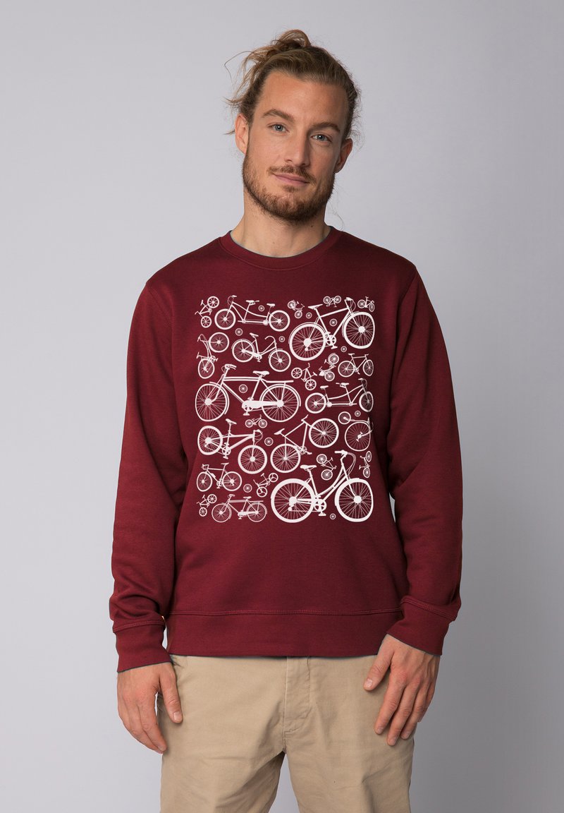 Sweat-shirt bordeaux avec un motif graphique de vélo blanc sur le devant. Fabriqué en tissu doux, avec des manches longues et un col rond.