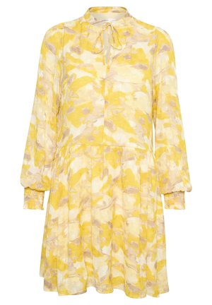 Vestido largo de manga larga con estampado floral en amarillo y beige, cintura fruncida, escote con lazo y puños elásticos.