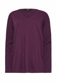  långärmad V-ringad skjorta i rik lila. Tillverkad av mjukt, lätt tyg med en avslappnad passform och subtil textur. Inga märkbara mönster eller accenter.