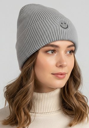 Gray knitted beanie featuring a ribbed texture and a small black smiley face patch at the front.