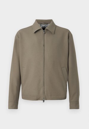 Khaki zip-up jacket with a collar, made of smooth fabric. Features side pockets and a clean, minimalist design.