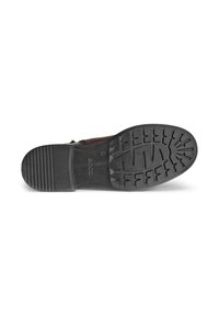 Sole di scarpa in gomma nera con motivi di texture orizzontali e verticali, caratterizzata da un logo; forma curvilinea con design ergonomico per il comfort.