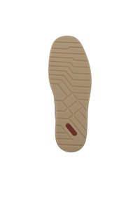Semelle de chaussure en caoutchouc brun clair avec un motif de texte en relief, arborant un logo rouge. Le design inclut des rainures pour offrir de l'adhérence et de la stabilité.