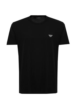 T-shirt nera a maniche corte con scollo tondo e piccolo logo bianco dell'aquila Emporio Armani sul petto a sinistra.