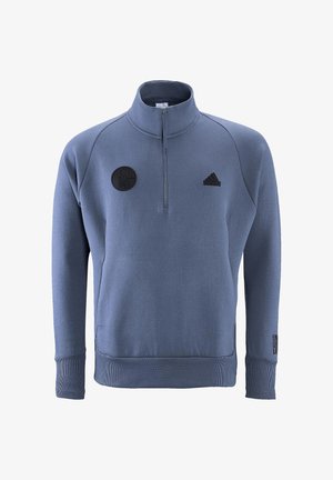 Blauwe fleece pullover met een kwartrits, ribbels aan de manchetten en onderkant. Voorzien van een zwart logo patch en "EIN LEHR." Tekstaccent op de linkermouw.