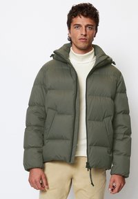 Olive green puffer jacket with a hood, featuring a zip closure, quilted design, front pockets, and drawstring at the hem.