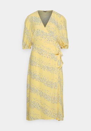 Yellow dress with a v-neck and short puff sleeves. Features a wrap design, side tie, and small blue floral print across the fabric.