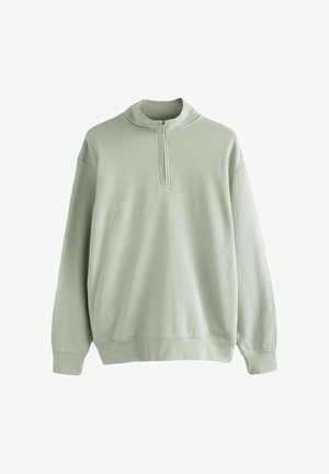 Hele-roheline pika varrukaga pullover kvartstõmblukuga krae ja soonikkoes mansettide ning alläärega, valgel taustal eksponeeritud.