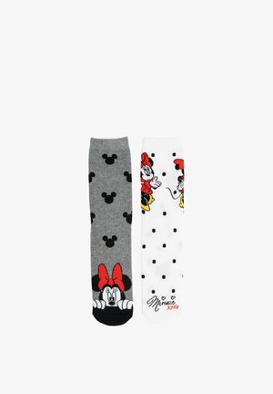 Two knee-high socks, one gray with black Mickey heads and Minnie peeking, one white with black polka dots and Minnie in red dress print.