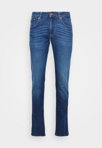 Jeans i denim i mörkblå färg med rak passform. Funktioner inkluderar knäppning, fem fickor, synlig sömnad och lätt blekning.