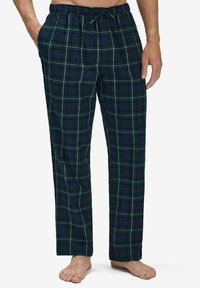 Pajama pants ruudullisena tummanvihreinä ja laivastonsinisinä, joissa on valkoisia viivoja. Joustava vyötärönauha, jossa on kiristysnauha. Pehmeä kangas; leveä, suora lahjemalli.