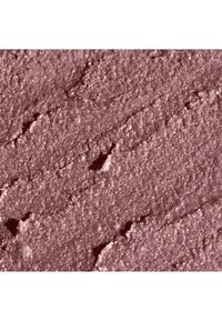 Puuteriposki pehmeässä mauven sävyssä, hienojakoinen koostumus hieman kimaltava, sileä pinta ja epätasaiset levitysjäljet.