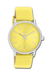 Montre ronde jaune avec une finition mate, marqueurs d'heures et aiguilles en argent. Bracelet en silicone jaune doux, quincaillerie en argent poli.