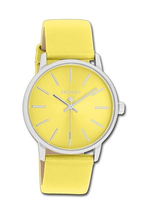 Montre ronde jaune avec une finition mate, marqueurs d'heures et aiguilles en argent. Bracelet en silicone jaune doux, quincaillerie en argent poli.