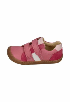 Child’s pink sneaker with two Velcro straps, white side stripe, and brown rubber sole, shown from the outer side.