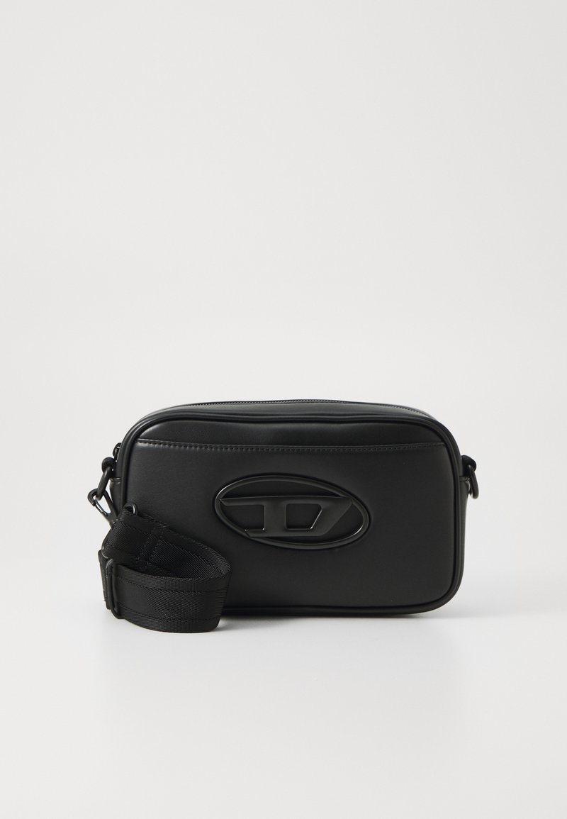 Black leather shoulder bag with a rectangular shape, a textured surface, embossed logo, and an adjustable strap. Zipper closure at top.