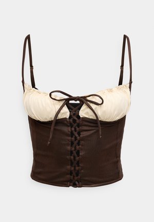 Corset top en tissu marron avec un décolleté froncé de couleur crème. Doté d'un laçage à l'avant et de fines bretelles réglables.