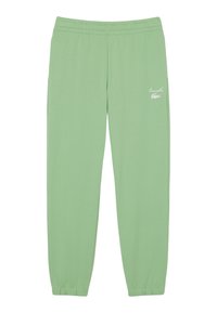 Lichtgroene sweatpants met elastische tailleband, taps toelopende boorden en een klein wit logo aan de linkerkant. Gemaakt van zachte, comfortabele stof.