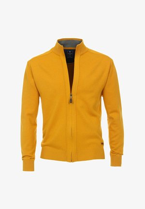 Pull zippé jaune moutarde homme avec poignets et ourlet côtelés, et un col montant avec doublure intérieure foncée.