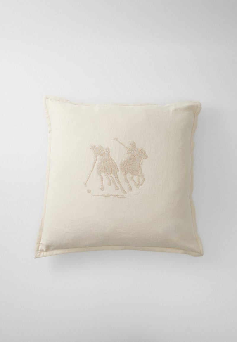 Linen cushion in off-white with two embroidered figures engaged in a sport. Features a textured surface and stitched edging detail.