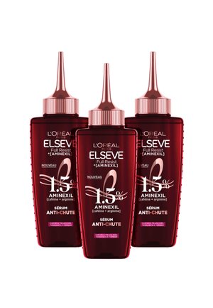 Trois bouteilles de sérum L'Oréal Elseve rouges avec des compte-gouttes pointus. Chaque bouteille présente des textes en blanc et rose, mettant en avant les ingrédients et les instructions d'utilisation.