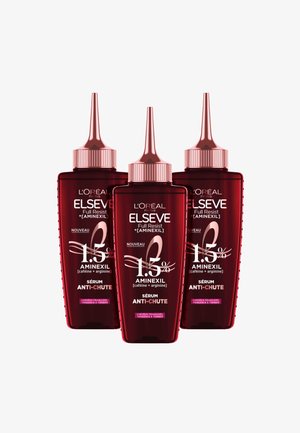 Trois bouteilles de sérum L'Oréal Elseve rouges avec des compte-gouttes pointus. Chaque bouteille présente des textes en blanc et rose, mettant en avant les ingrédients et les instructions d'utilisation.