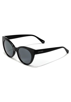 Cat-eye sunglasses with black plastic frames, gray tinted lenses, and smooth finish. Features logo on the left arm and curved temples.