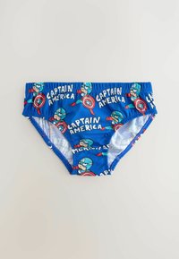 Blå simbyxor med ett upprepat mönster av Captain America-grafik och vit text. Elastisk midja, mjukt tyg och fodrad insida.