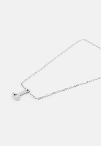 Silver chain necklace with a geometric anchor pendant. Features a smooth, polished finish and elongated oval links. Simple design.