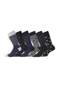 Six paires de chaussettes, avec divers motifs incluant des rayures et des pois. Les couleurs comprennent le bleu foncé, le gris, et le noir avec une texture en coton.